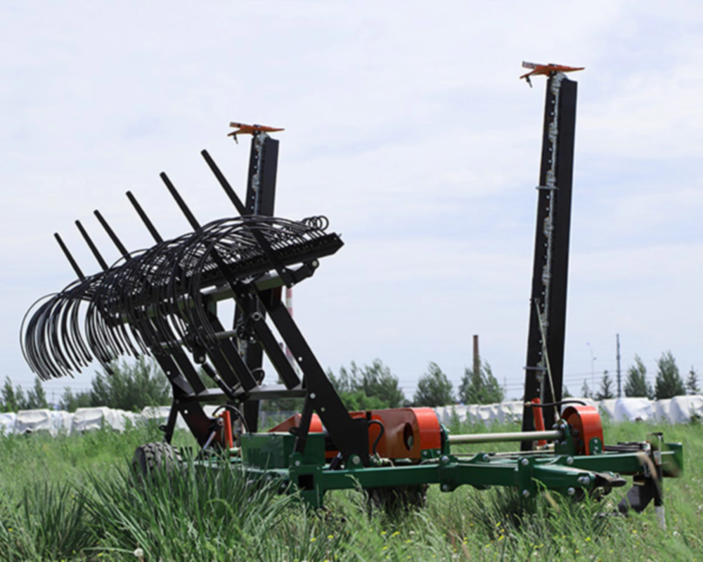 Tractor-Pulled Lawn Mower with Rake operating in a large estate field