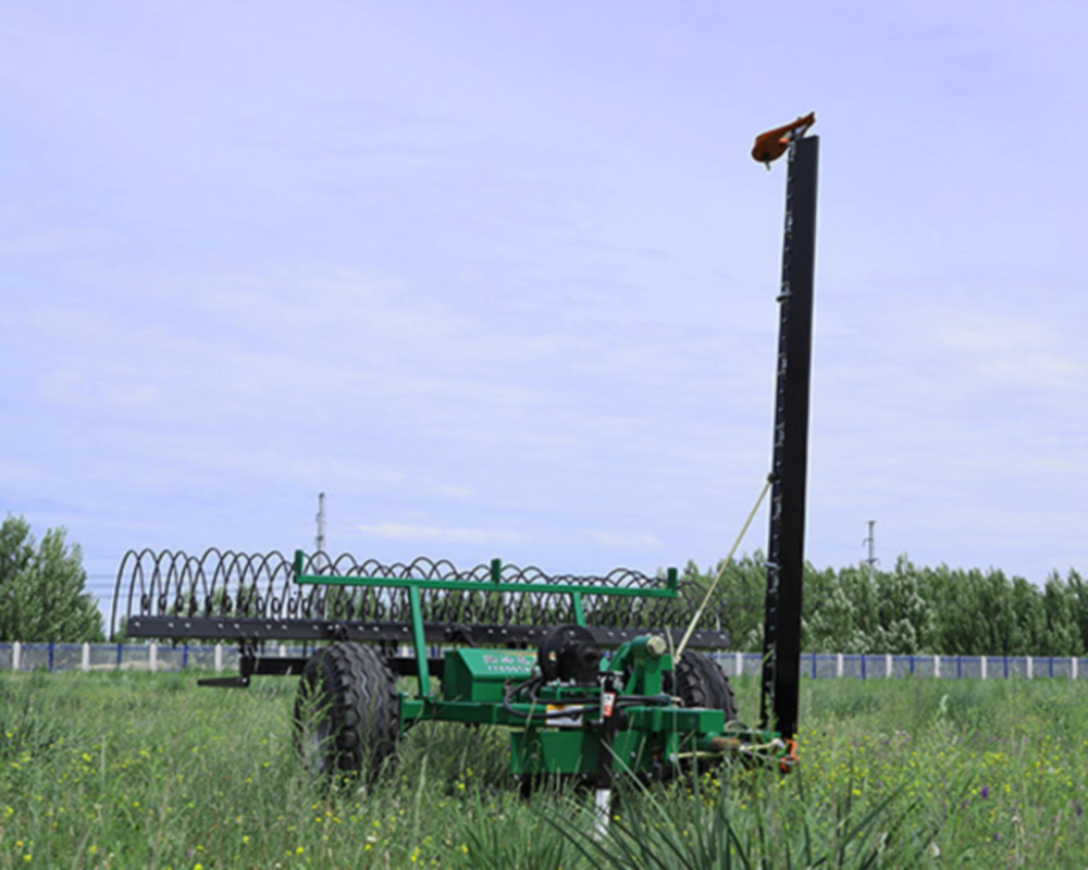 Tractor smoothly operating the mower and rake combo to align grass into neat windrows